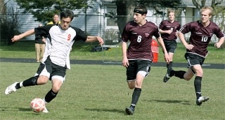 Coupeville senior Geoff Wacker works the ball past Lakewood defender Brandon Ochoa