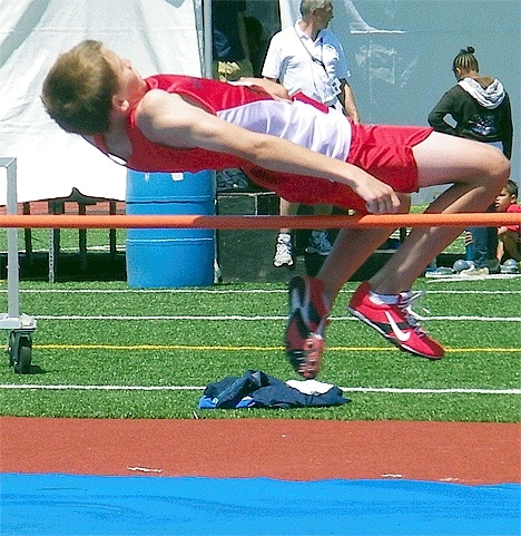Dakota Powers floats over the bar in the high jump. He qualified for regional competition in the event and also won the 3