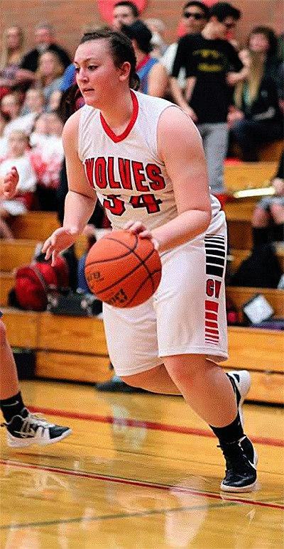 Hailey Hammer attacks the baseline in Coupeville's win over Chimacum. Hammer is one of six seniors who played in her final home game Friday.