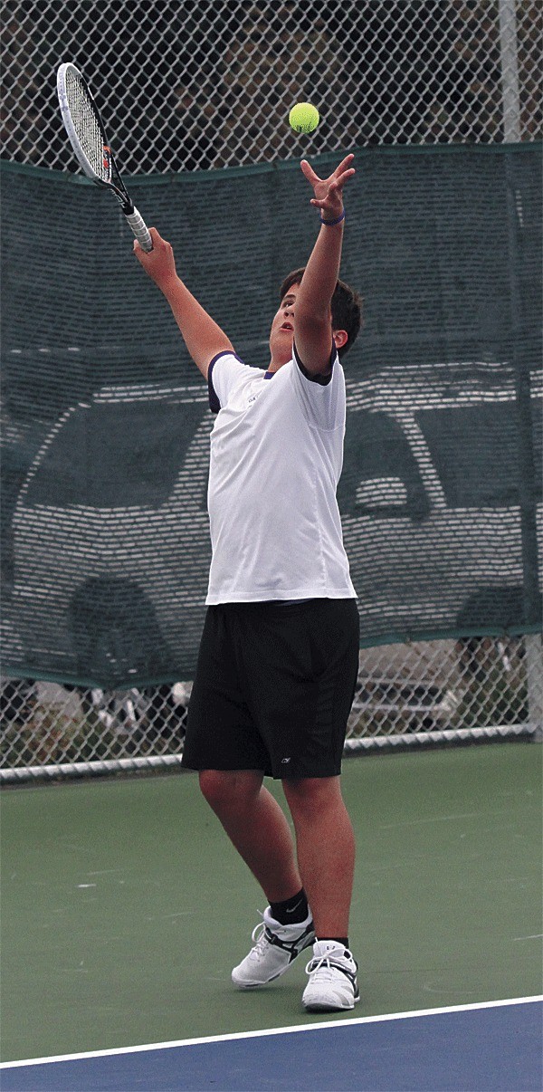 Oak Harbor's Carter Saar prepares to fire a serve against Lynnwood Thursday.