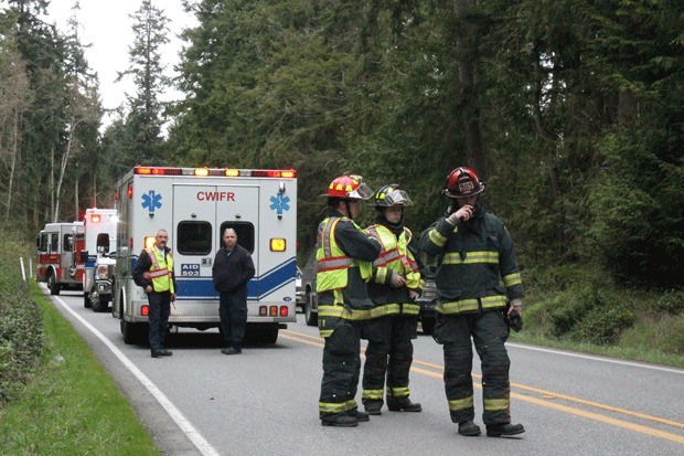 Firefighters respond to a car crash that cut power in Central Whidbey Wednesday.