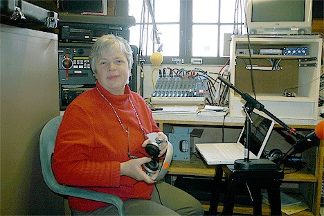 Gwen Sam broadcasts Whidbey Chat from the KWPA studio located in the Coupeville Wharf. Her community radio show is the first live broadcast produced by the radio station.