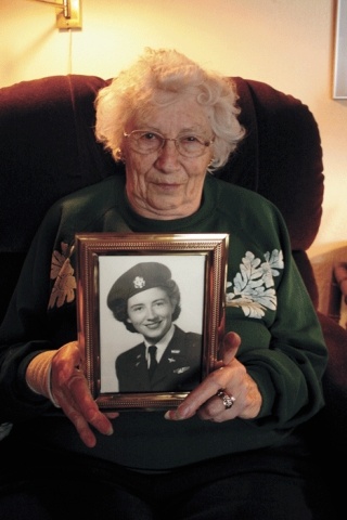 Margaret Martin holds a photo of herself taken during World War II. She and 300 other women may receive Congressional Gold Medals for their service in the Women Airforce Service Pilots program.
