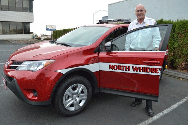 Sara Hansen / Whidbey News-Times North Whidbey Fire and Rescue Chief Marv Koorn shows off one of the new 2013 Toyota RAV4s the district purchased to replace older emergency response vehicles.