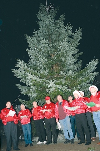 The An-O-Chords sing holiday tunes and Disney favorites at the base of the 30-foot downtown Christmas tree.