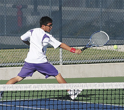Oak Harbor's Jose Dimaculangan runs down a ball in first doubles.