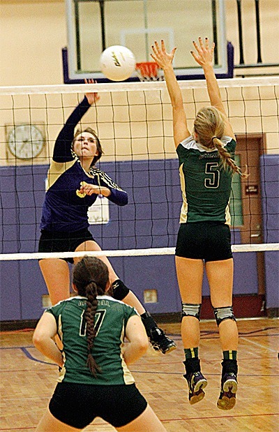Hailey Beecher hits by the block of Marysville Getchell's Ruth Reznikov (5) in the Wildcats' win Tuesday.