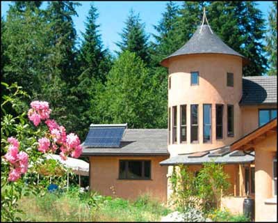 A straw bale community center with a tower stands near Langley.