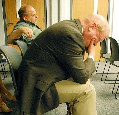Island County Sheriff Mark Brown listens to a discussion among the Island County commissioners last week concerning a proposed sales tax for the law and justice community.
