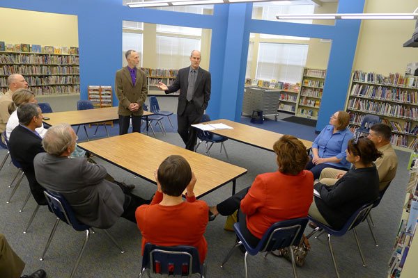 Oak Harbor School District Superintendent Rick Schulte and U.S. Rep. Rick Larsen discusses Impact Aid to a small group of people Friday at Olympic View Elementary. Larsen is co-sponsoring a bill that will be introduced next week that will improve the way federal Impact Aid dollars is dispersed.