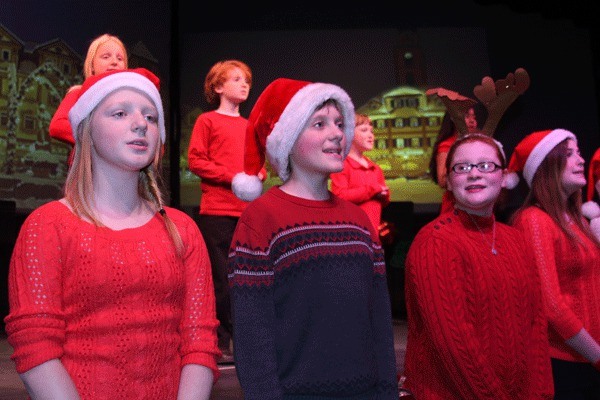 A children’s chorus chimes in regularly during ‘Christmas Snapshots