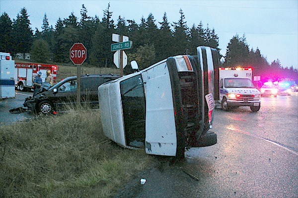 A Ford Bronco lays on its side after an accident on Highway 20 and North Jones Road Wednesday evening. Four people were sent to the hospital but were released later the same evening.