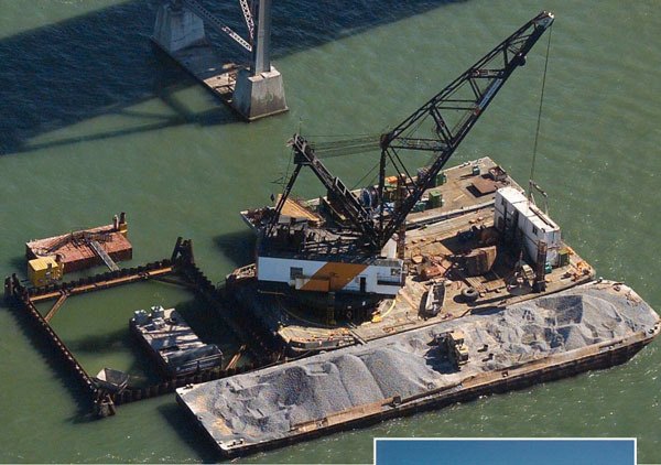 The 140-foot D.B. Oakland will be one of two cranes working to raise the sunken 128-foot fishing boat