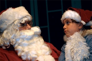 Santa Claus (Norm Boynton) tells Marie