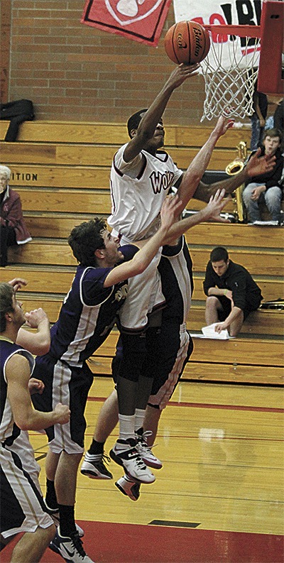 Coupeville's Anthony Bergeron tries to tip-in a teammate's missed shot.