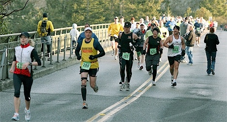 Whidbey Island Marathon runners cross the Deception Pass Bridge in this year's version of the eight-year-old event. The city of Oak Harbor hopes to buy the marathon for $50