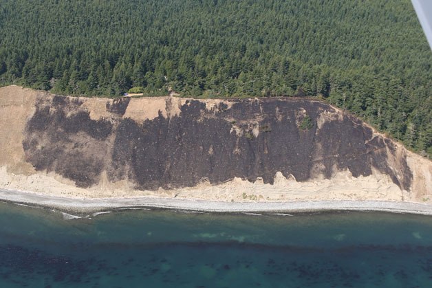 An aerial view Thursday of the 10-acre brushfire that scorched the bluff along Fort Ebey State Park Wednesday