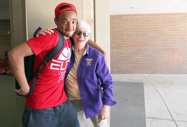Dean of Students Pat Felger gets a hug from student Jordan Park at Oak Harbor High School.