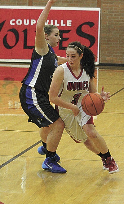 Coupeville's Amanda Fabrizi dribbles around the defensive pressure of South Whidbey.