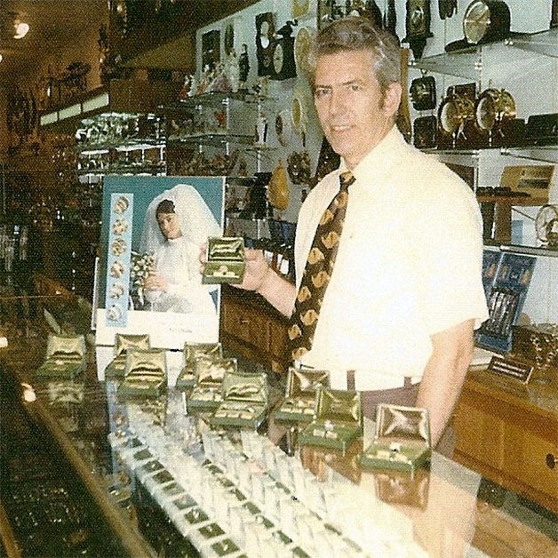 Gerald Fikse working at his own jewelry store on Midway Boulevard.