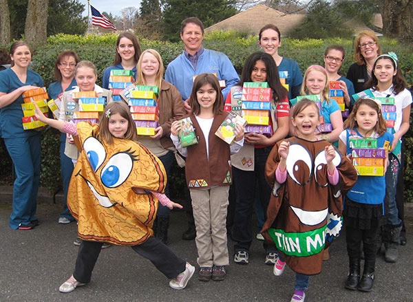 Ron Newberry/Whidbey News-Times Girl Scouts deliver cookies at Gardner Orthodontics in Oak Harbor. Front row