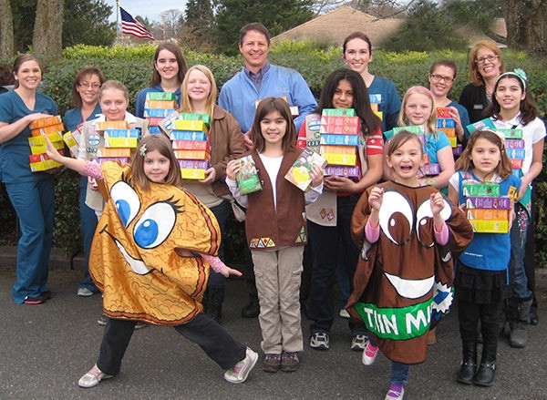 Ron Newberry/Whidbey News-Times Girl Scouts deliver cookies at Gardner Orthodontics in Oak Harbor. Front row