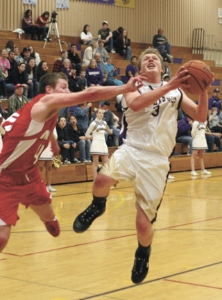 Senior Beaux Haley takes the ball down the lane to score in his final game as a Wildcat.