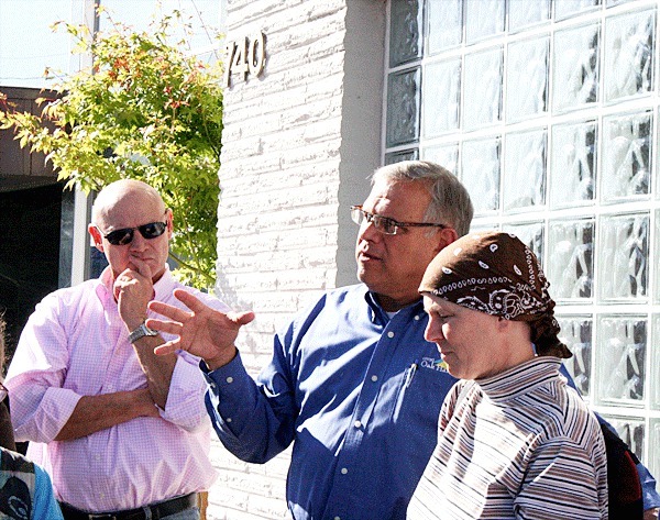 Oak Harbor Mayor Jim Slowik answers questions from the Sustainable Whidbey Coalition members about the Pioneer Way project during a walking tour of the street in September.