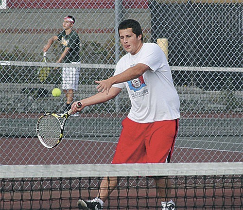 Coupeville's Kyle Bodamer returns a shot against Overlake Friday. Bodamer teamed with Brian Nelson to win second doubles.