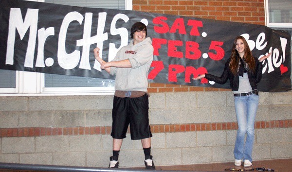 Seniors Cody Grassman and Taylor Herreman do their best to entice students to come to the high school’s first ever Mr. CHS pageant