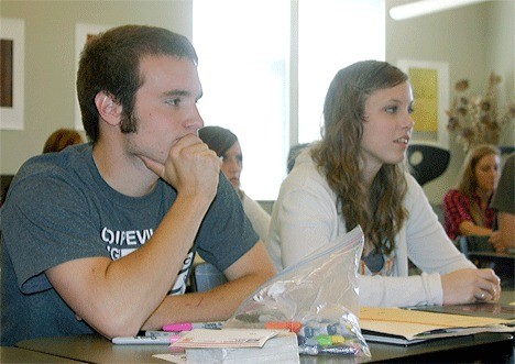Coupeville High School seniors Garrett Franzen and Holly Block listen to their teacher as they finish their last week of school. They are two of the more than 80 members of the class of 2010 who will graduate Friday evening at the high school gymnasium.