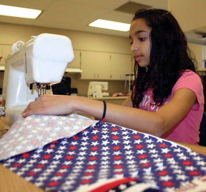 Seventh-grade student Chante Powell learned to sew to make quilts for the American Hero Quilts project.