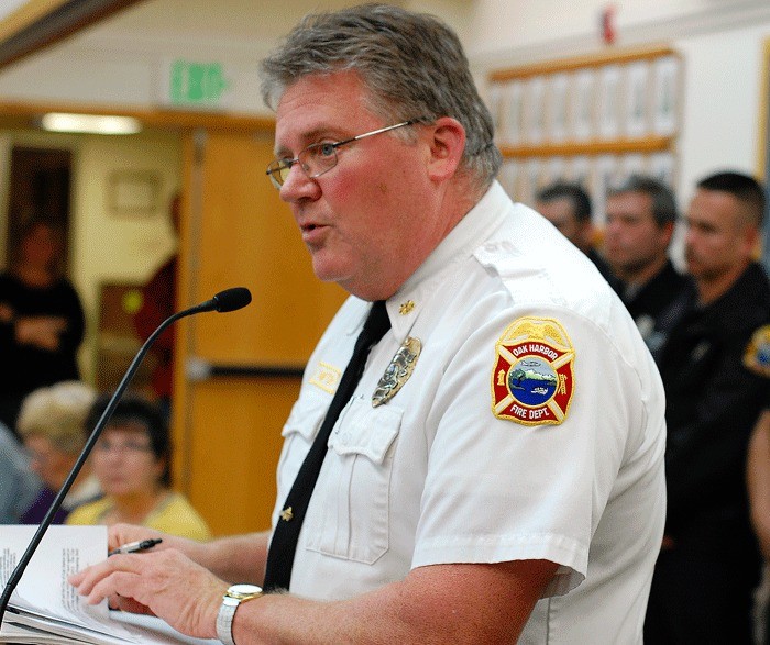 Oak Harbor Fire Department Chief Mark Soptich addresses the city council Tuesday. The department’s union