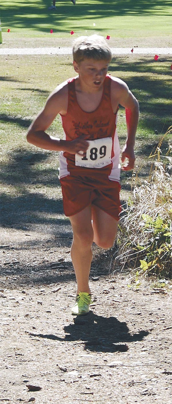 Logan Clark of the Whidbey Island Running Club runs to a first-place finish in the youth boys division of the Runnin' the Rock cross country meet Oct. 8.