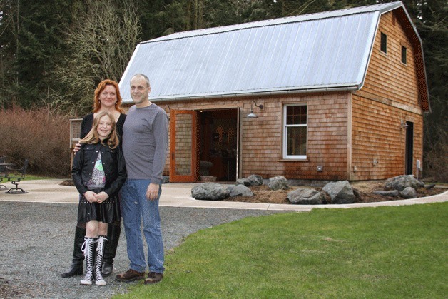Mike and Megan Wise and daughter Ella in front of their Coupeville art studio that is part of the Whidbey Working Artists Studio Tour March 7-9.