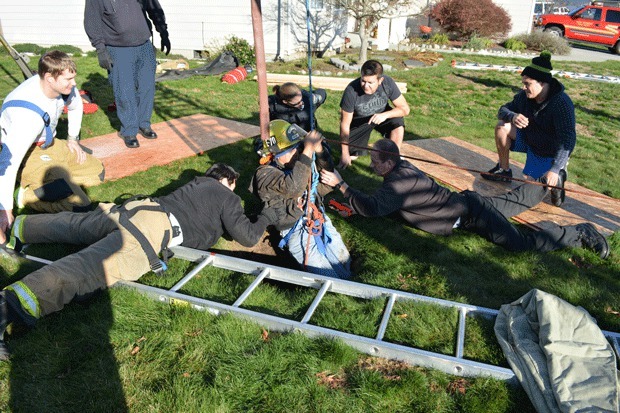 Firefighters rescue an Oak Harbor man who fell down an abandoned well Saturday morning.