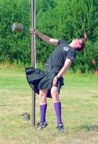 John Lambert from Port Orchard tosses a 56-pound weight over a bar Saturday during the Whidbey Island Highland Games