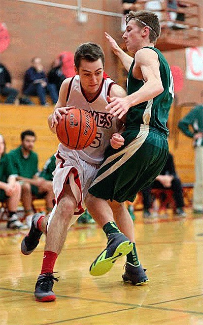 Coupeville's Aaron Curtin blasts by Klahowya's Keegan Greliner.