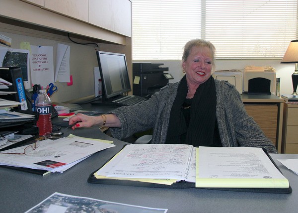 Oak Harbor Economic Development Director Barbara Spohn poses at her desk in City Hall.
