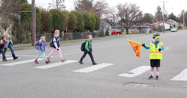 Children head to school at Broad View Elementary in Oak Harbor Friday morning. Under a proposal