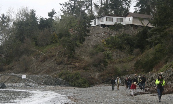 A home pushed 400 feet after a massive landslide last year burned down last week. Fire crews had trouble getting to the home.