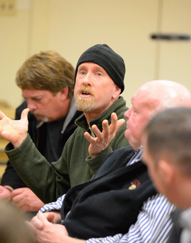 North Whidbey resident Omer Lupien is one of about 40 burglary victims to attend a special meeting with law enforcement Thursday night. He expressed frustration with police response.