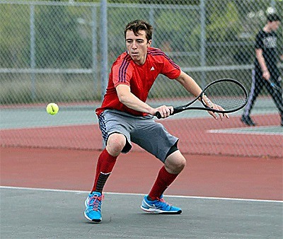 Sebastian Davis shoots a backhand in his win Friday.