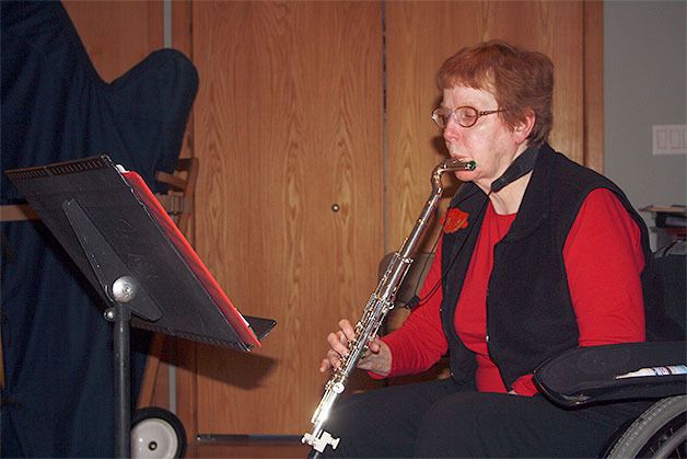 Rae Terpenning practices using her new one-handed flute