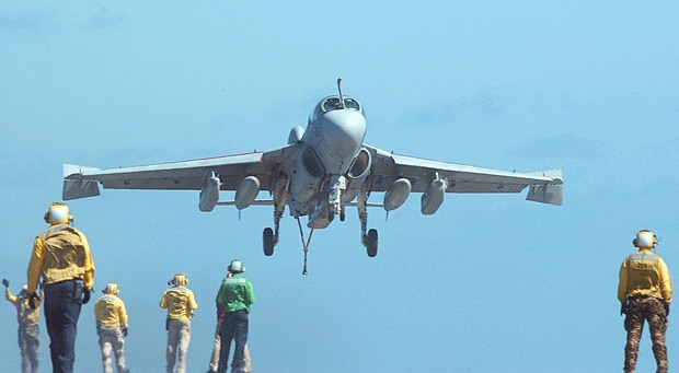 A Prowler lands aboard an aircraft carrier.