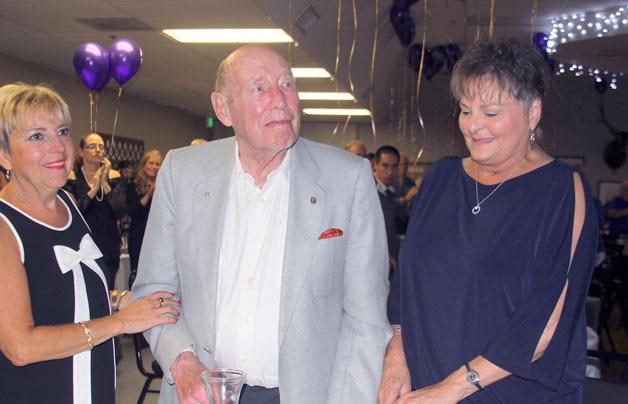 Flanked by Debbie Skinner