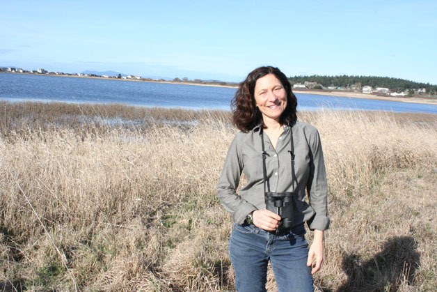 Former Island County commissioner Angie Homola stands in front of Swan Lake