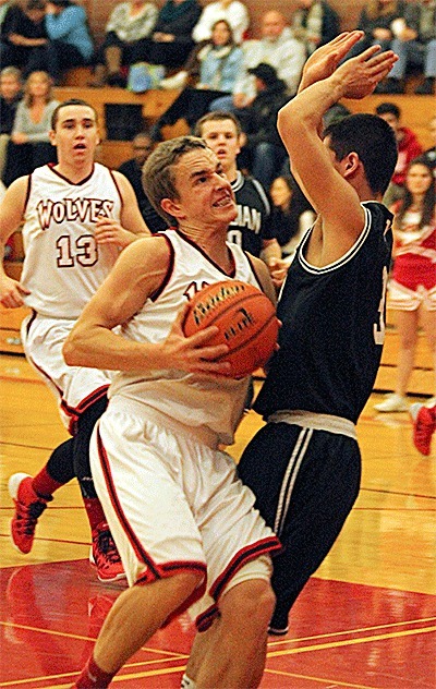 Joel Walstad powers to hoop for a three-point play for Coupeville Monday.