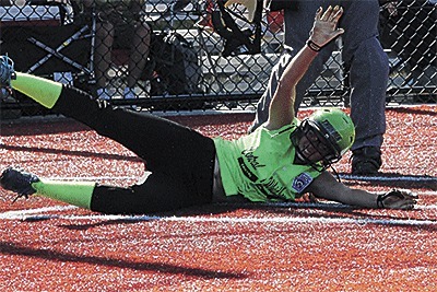 Katrina McGranahan slides home for Central Whidbey's second run Saturday.