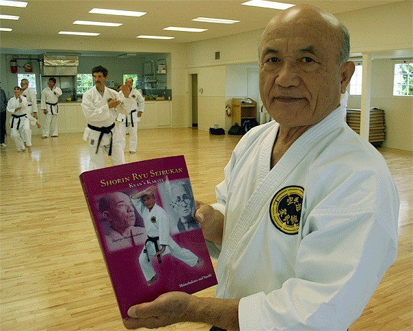 Hanshi Zenpo Shimabukuro shows a book he spent years writing that will help with the training of a traditional style of karate.